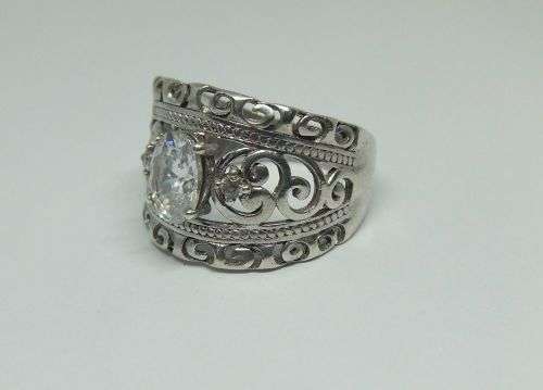 A SUPERB SOLID STERLING SILVER RING WITH UNIQUE DESIGN SET WITH FACETED CZ STONES !! FULLY TESTED !!