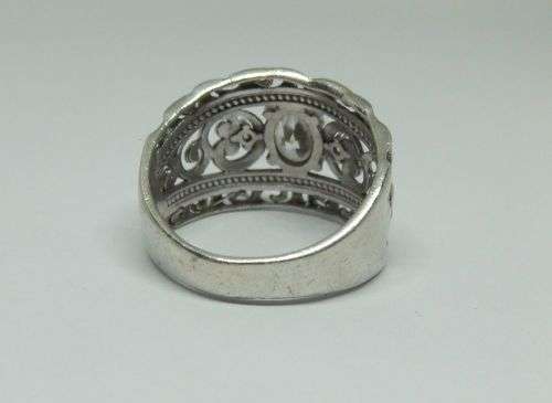 A SUPERB SOLID STERLING SILVER RING WITH UNIQUE DESIGN SET WITH FACETED CZ STONES !! FULLY TESTED !!