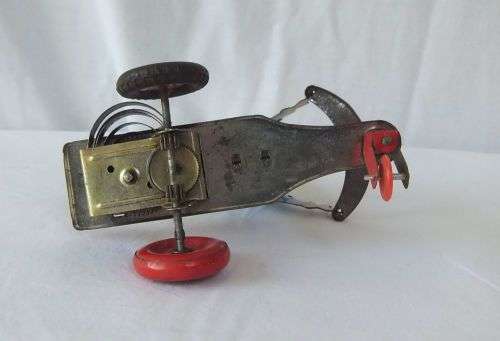 A TOTALLY COOL VINTAGE TIN PLATE CLOCKWORK SCOOTER CLOWN IN WORKING CONDITION !! WOW !!