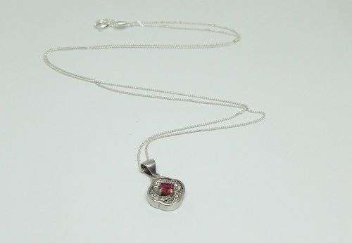 R1 START !! A Sterling Silver necklace with Sterling Silver pendant set with a faceted red stone !!