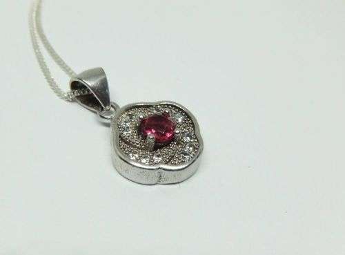 R1 START !! A Sterling Silver necklace with Sterling Silver pendant set with a faceted red stone !!