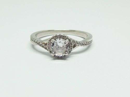 R1 START !! An elegant solid Sterling Silver ring set with faceted clear CZ stones !! FREE COMBINING