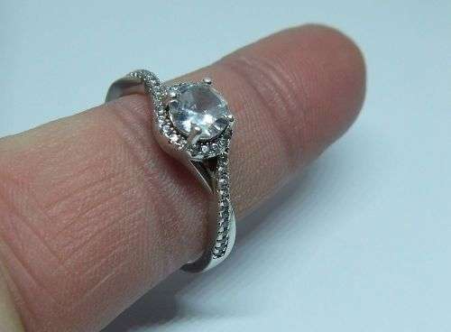 R1 START !! An elegant solid Sterling Silver ring set with faceted clear CZ stones !! FREE COMBINING