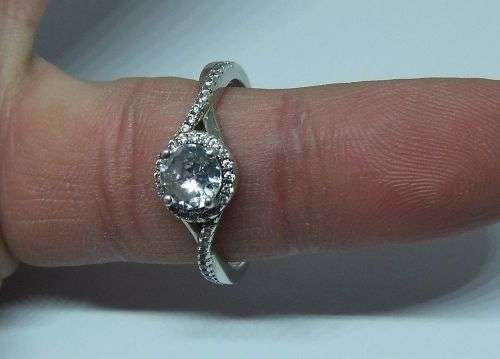 R1 START !! An elegant solid Sterling Silver ring set with faceted clear CZ stones !! FREE COMBINING