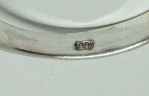 WOW ! A STUNNING SOLID STERLING SILVER RING SET WITH A FACETED LIGHT BLUE STONE !! LOTS OF CURVES !!