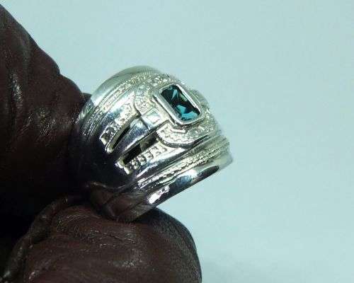 AN EXCEPTIONAL WIDE SOLID STERLING SILVER RING SET WITH A FACETED BLUE STONE IN GREAT CONDITION !!