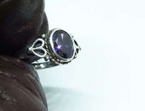 WOW !! A DELIGHTFUL SOLID STERLING SILVER RING SET WITH A FACETED PURPLE STONE !! SUCH A BEAUTY !!