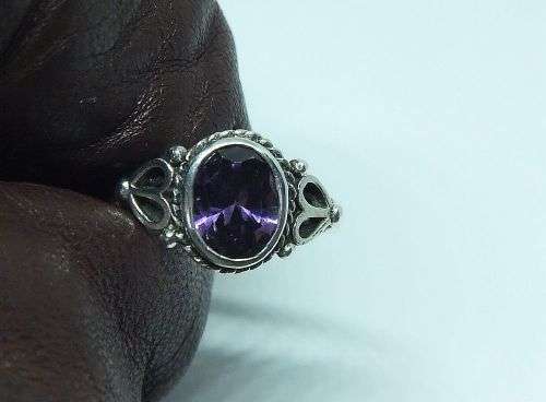 WOW !! A DELIGHTFUL SOLID STERLING SILVER RING SET WITH A FACETED PURPLE STONE !! SUCH A BEAUTY !!