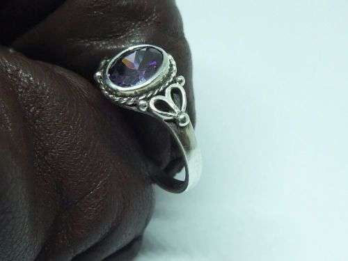 WOW !! A DELIGHTFUL SOLID STERLING SILVER RING SET WITH A FACETED PURPLE STONE !! SUCH A BEAUTY !!