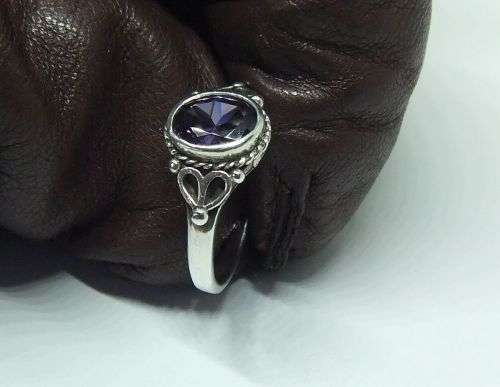 WOW !! A DELIGHTFUL SOLID STERLING SILVER RING SET WITH A FACETED PURPLE STONE !! SUCH A BEAUTY !!