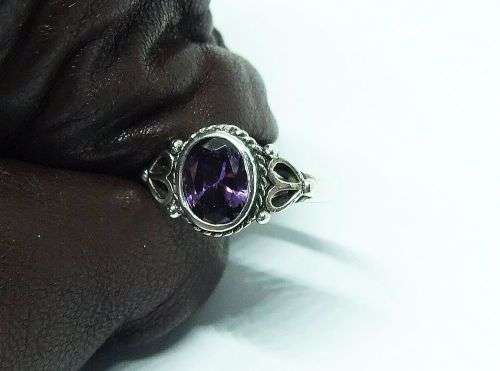 WOW !! A DELIGHTFUL SOLID STERLING SILVER RING SET WITH A FACETED PURPLE STONE !! SUCH A BEAUTY !!