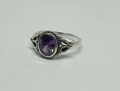 WOW !! A DELIGHTFUL SOLID STERLING SILVER RING SET WITH A FACETED PURPLE STONE !! SUCH A BEAUTY !!