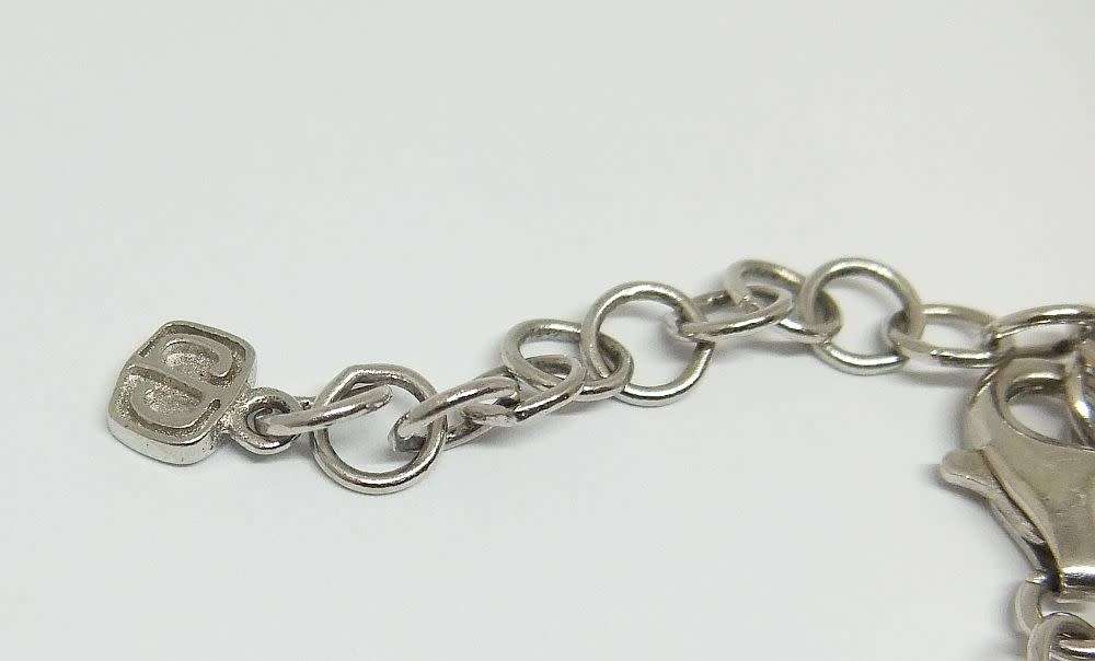 A MAGNIFICENT DESIGNER STERLING SILVER BRACELET SET WITH FACETED BLUEISH PEAR SHAPED STONES !! WOW !