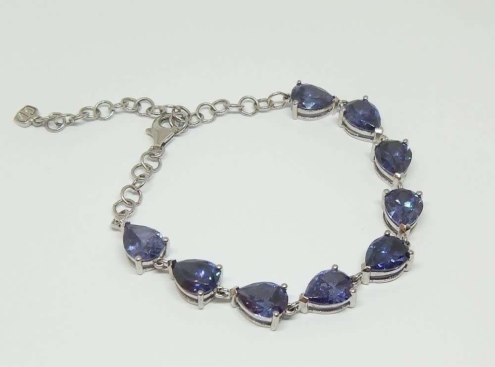 A MAGNIFICENT DESIGNER STERLING SILVER BRACELET SET WITH FACETED BLUEISH PEAR SHAPED STONES !! WOW !
