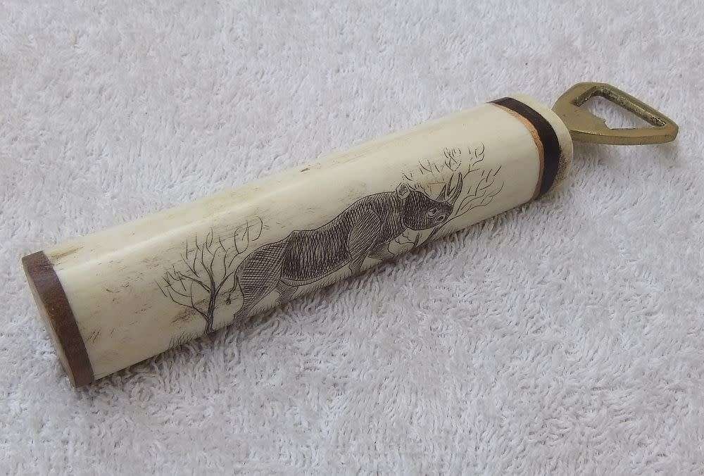 WOW !! AN AWESOME VINTAGE GENUINE BONE & WOOD HANDLE BOTTLE OPENER WITH RHINO ENGRAVING !!