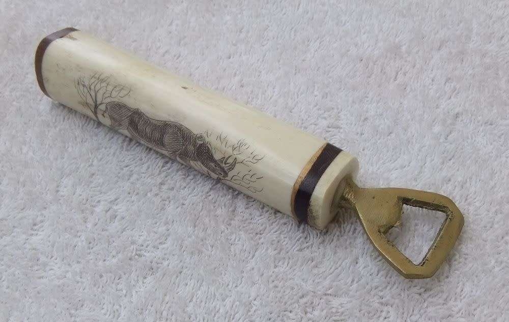 WOW !! AN AWESOME VINTAGE GENUINE BONE & WOOD HANDLE BOTTLE OPENER WITH RHINO ENGRAVING !!