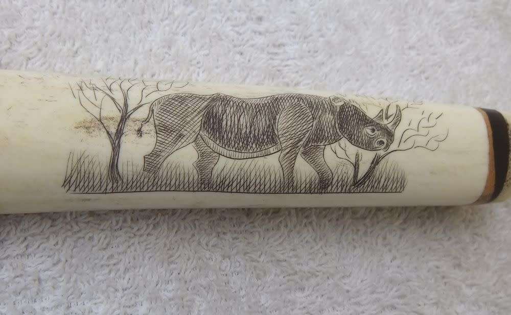 WOW !! AN AWESOME VINTAGE GENUINE BONE & WOOD HANDLE BOTTLE OPENER WITH RHINO ENGRAVING !!