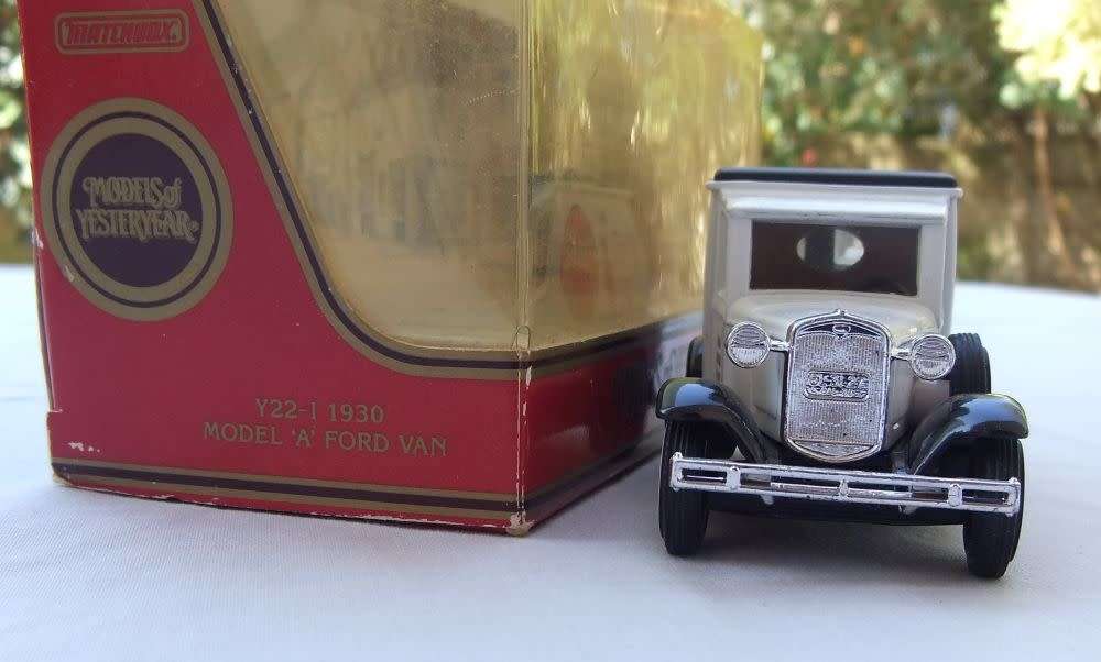 A VINTAGE DIE CAST METAL MODEL OF THE 1930 MODEL `A` FORD VAN BY MATCHBOX MODELS OF YESTERYEAR