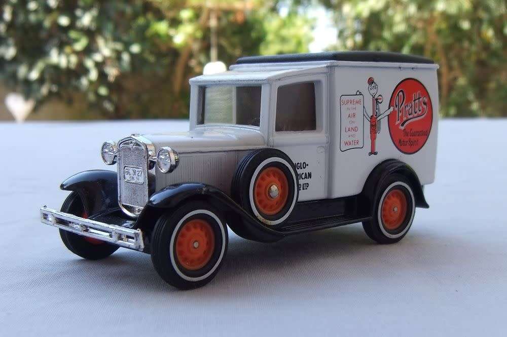 A VINTAGE DIE CAST METAL MODEL OF THE 1930 MODEL `A` FORD VAN BY MATCHBOX MODELS OF YESTERYEAR