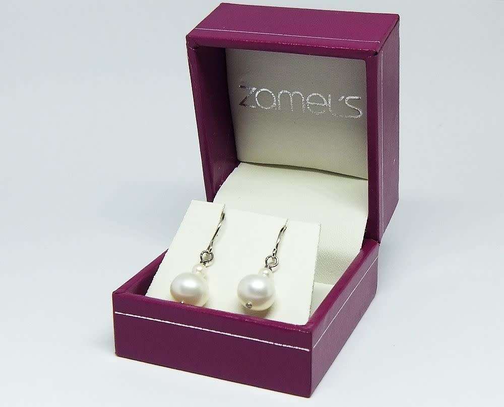 A pair of genuine sterling silver and freshwater pearl earrings - Never worn - With box