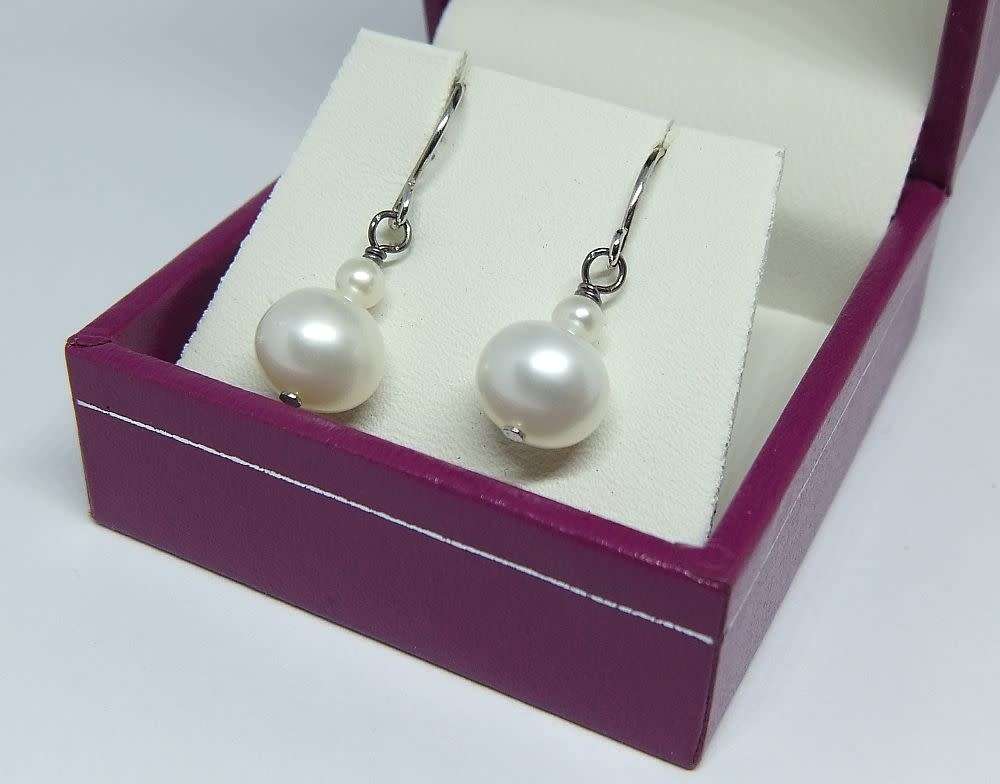 A pair of genuine sterling silver and freshwater pearl earrings - Never worn - With box
