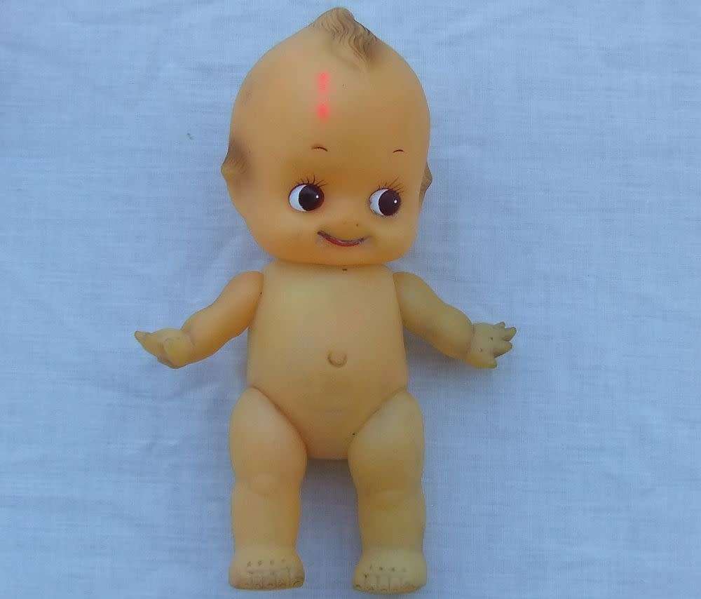 Three vintage Kewpie dolls for display