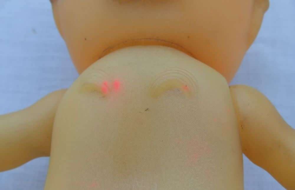 Three vintage Kewpie dolls for display