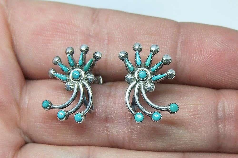 A vintage pair of sterling silver screw on earrings with Turquoise insets