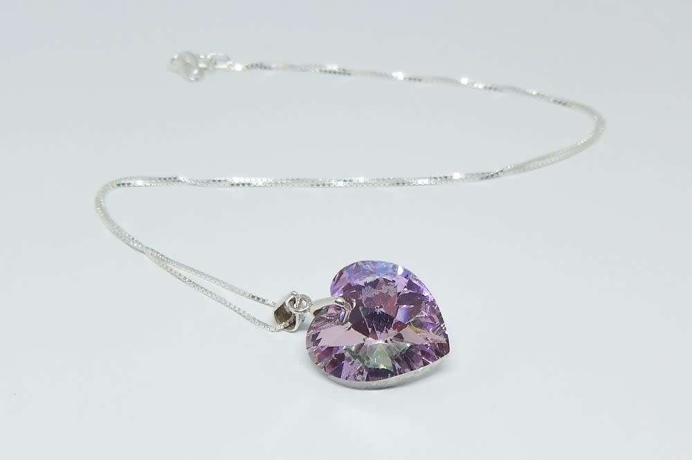 A genuine sterling silver necklace with a sterling silver mounted heart pendant - glass or crystal