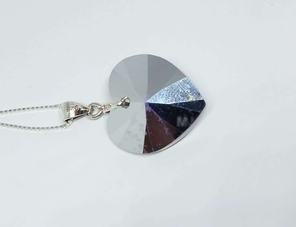 A genuine sterling silver necklace with a sterling silver mounted heart pendant - glass or crystal