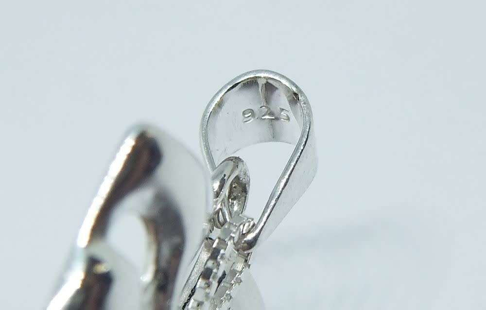 A genuine sterling silver necklace with sterling silver double mask pendant - Brand new