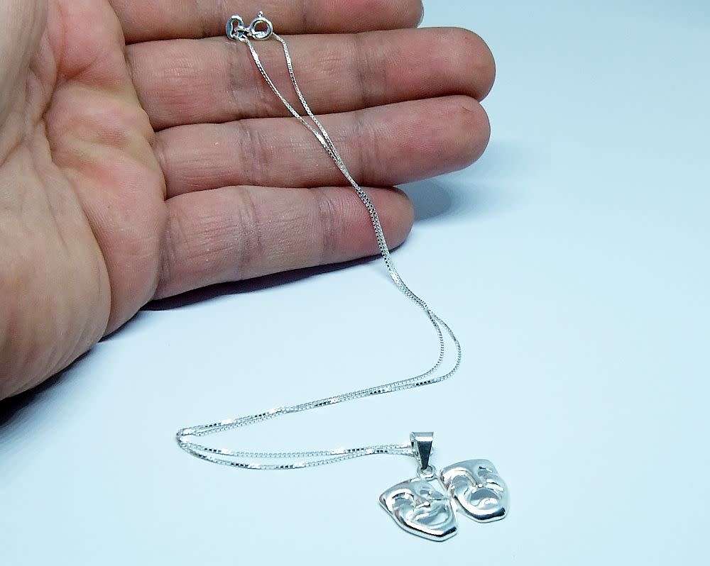A genuine sterling silver necklace with sterling silver double mask pendant - Brand new