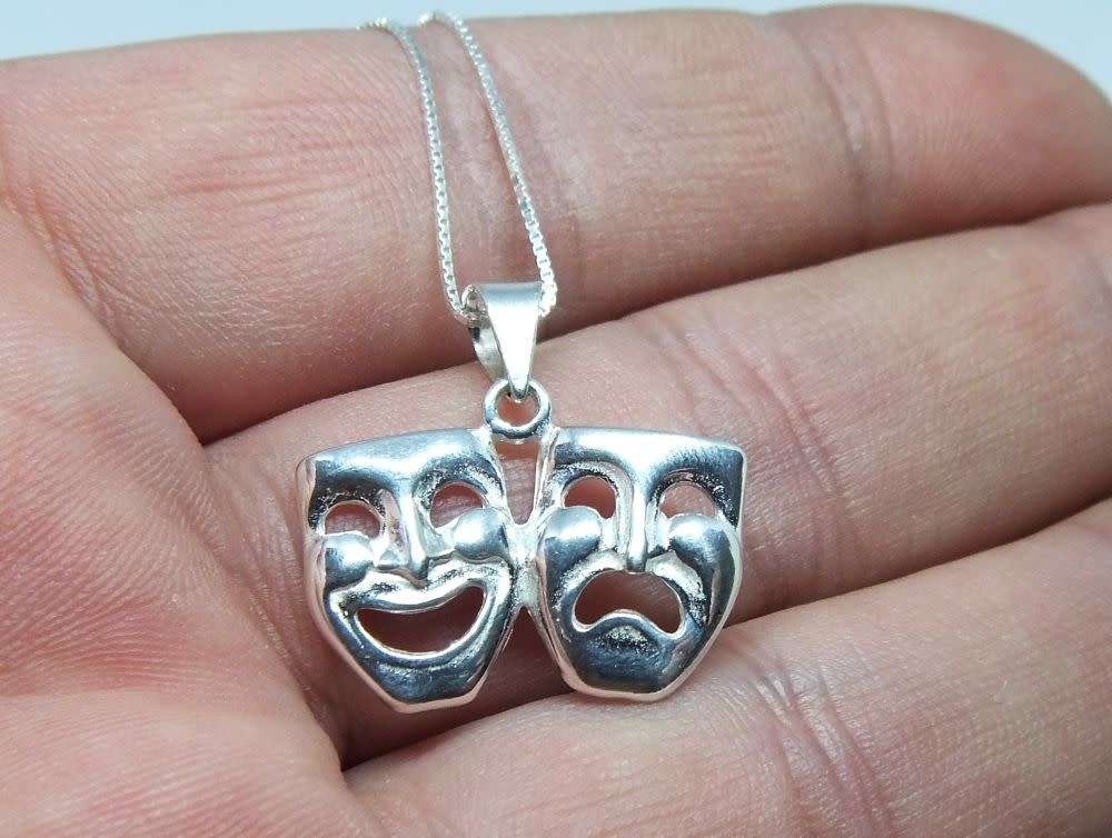 A genuine sterling silver necklace with sterling silver double mask pendant - Brand new