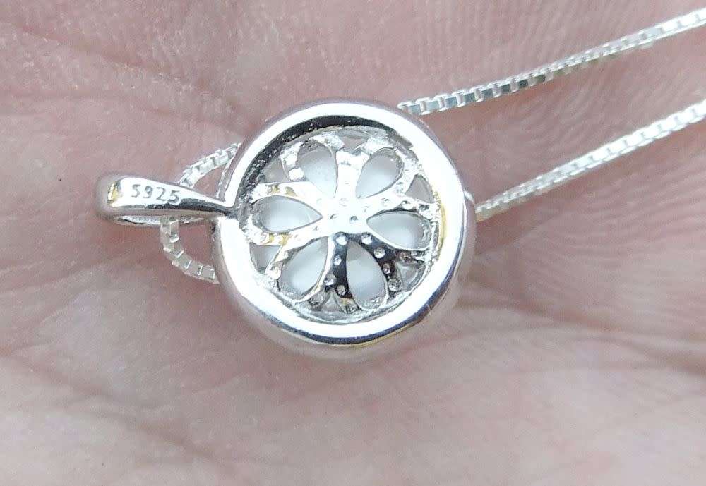 A genuine sterling silver necklace and genuine Mabe pearl pendant - Brand new - Boxed