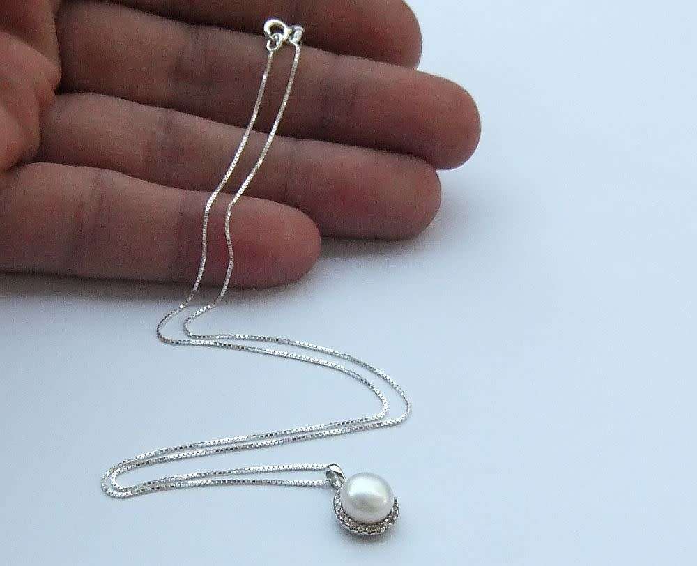A genuine sterling silver necklace and genuine Mabe pearl pendant - Brand new - Boxed