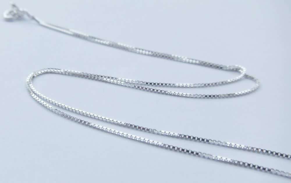 A genuine sterling silver necklace and sterling silver coin pendant - Brand new - Boxed