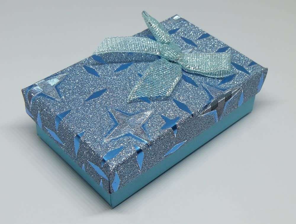 A genuine sterling silver necklace and cross pendant with faceted clear insets plus gift box