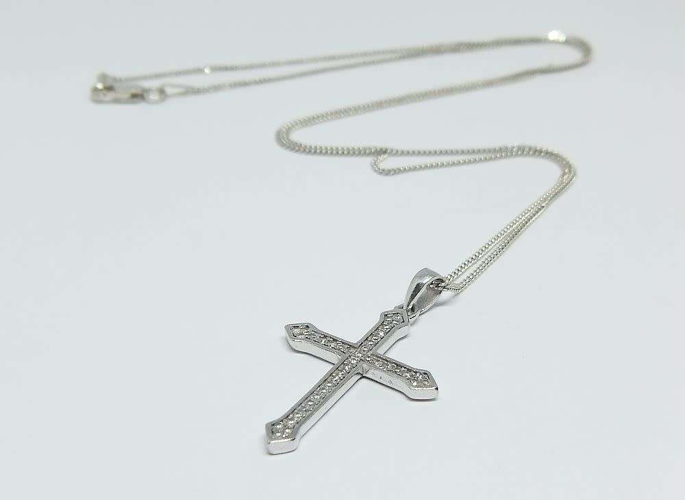 A genuine sterling silver necklace and cross pendant with faceted clear insets plus gift box