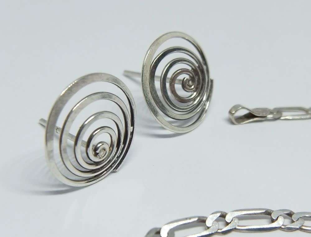 A pair of sterling silver spiral earrings and a sterling silver bracelet - Bid for both