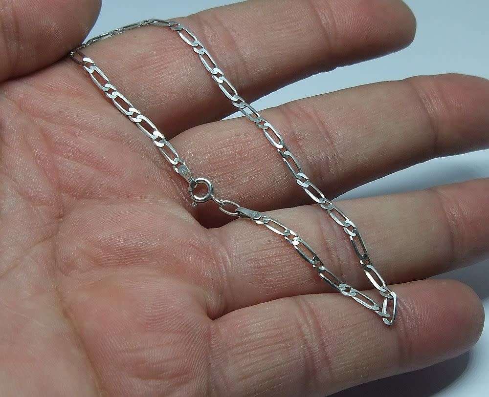 A pair of sterling silver spiral earrings and a sterling silver bracelet - Bid for both