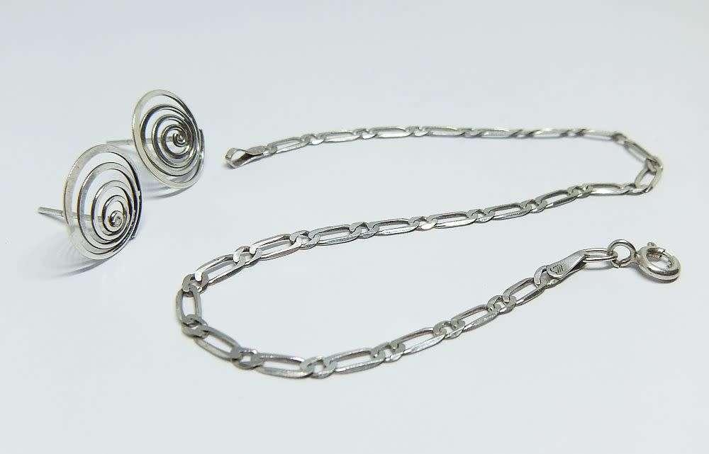 A pair of sterling silver spiral earrings and a sterling silver bracelet - Bid for both