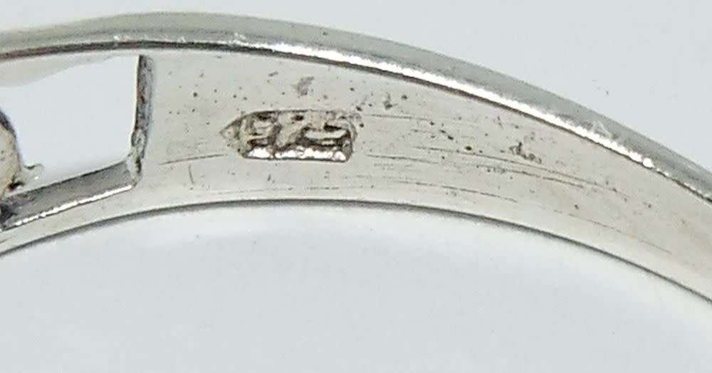 A genuine sterling silver necklace with mabe pearl pendant + sterling silver heart motif ring