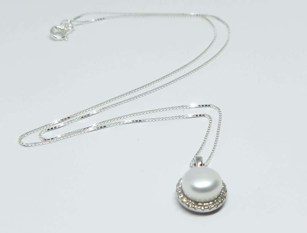 A genuine sterling silver necklace with mabe pearl pendant + sterling silver heart motif ring