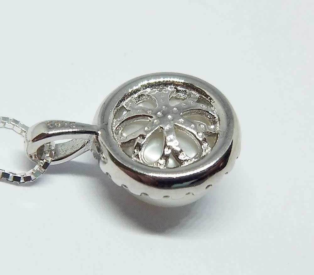 A genuine sterling silver necklace with mabe pearl pendant + sterling silver heart motif ring