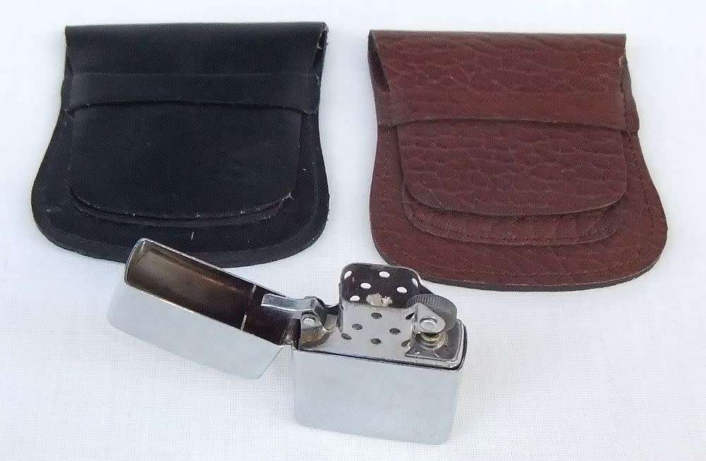 Two genuine leather Zippo holders plus a Star windproof lighter - never used - gift idea