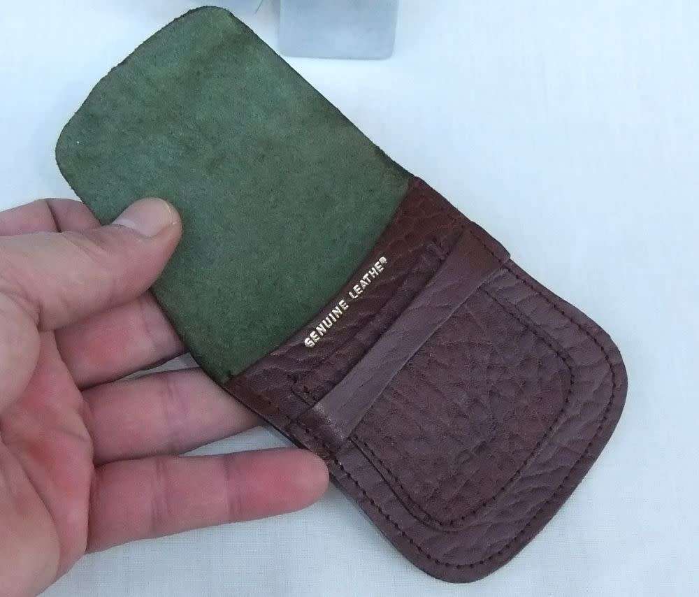 Two genuine leather Zippo holders plus a Star windproof lighter - never used - gift idea