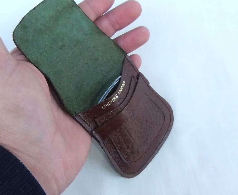 Two genuine leather Zippo holders plus a Star windproof lighter - never used - gift idea