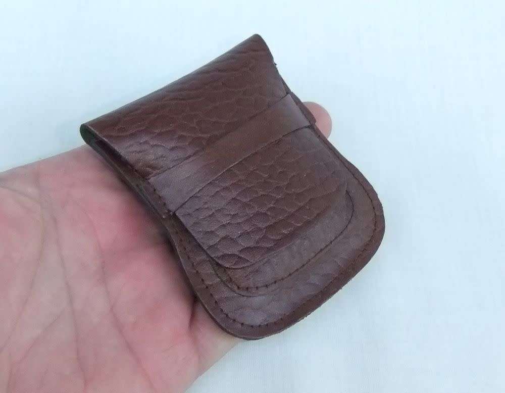 Two genuine leather Zippo holders plus a Star windproof lighter - never used - gift idea