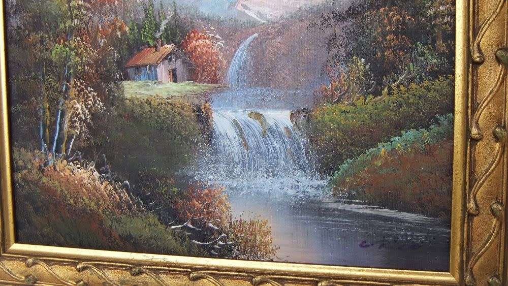 A signed oil painting depicting a forrest landscape with cottage and waterfalls
