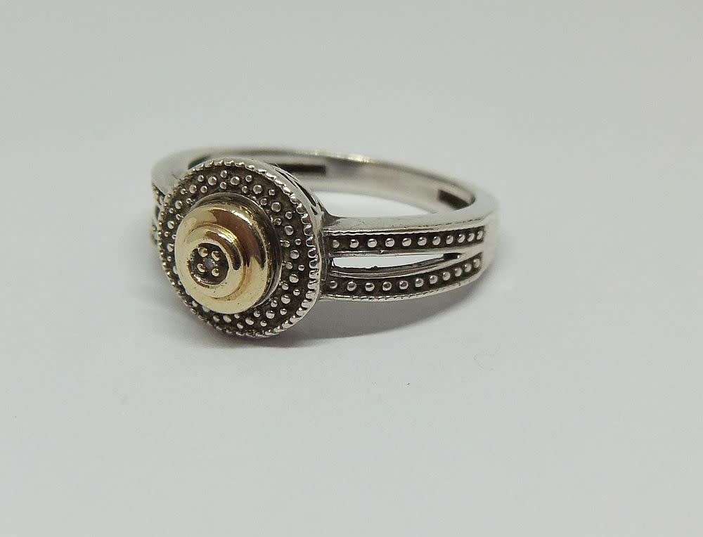 A gorgeous genuine sterling silver ring with gold accent and tiny faceted inset